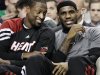 Miami Heat's Dwyane Wade, left, and LeBron James chat on the bench during the first minutes of an NBA basketball game against the Boston Celtics in Boston, Tuesday, April 24, 2012. (AP Photo/Elise Amendola)