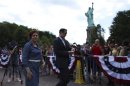 New York mayoral candidate Christine Quinn takes a tour to the Statue of Liberty and Liberty Island during its reopening to the public in New York