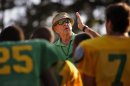 In this Oct. 24, 2012 photo, Summerville High School coach John McKissick coaches his team during practice in Summerville, S.C. McKissick is on the verge of his latest milestone in a career full of them, a game away from his 600th football win. (AP Photo/Stephen Morton)