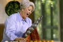 FILE - This 2006 file photo originally released by the Food Network shows celebrity chef Paula Dean. Paula Deen's fans are serving up deep-fried outrage to the Food Network for its decision to dump the Southern comfort food queen after she acknowledged using racial slurs in the past. (AP Photo/ Food Network, file)