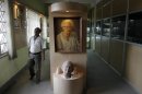 A portrait of Indian scientist Satyendranath Bose, is displayed at the Bangiya Vigyan Parishad or the Bengal Science Society founded by Bose in Kolkata, India, Tuesday, July 10, 2012. While much of the world was celebrating the international cooperation that led to last week's breakthrough in identifying the existence of the Higgs boson particle, many in India were smarting over what they saw as a slight against one of their greatest scientists. Media covering the story gave lots of credit to British physicist Peter Higgs for theorizing the elusive subatomic "God particle," but little was said about Satyendranath Bose, the Indian after whom the boson is named. (AP Photo/Bikas Das)