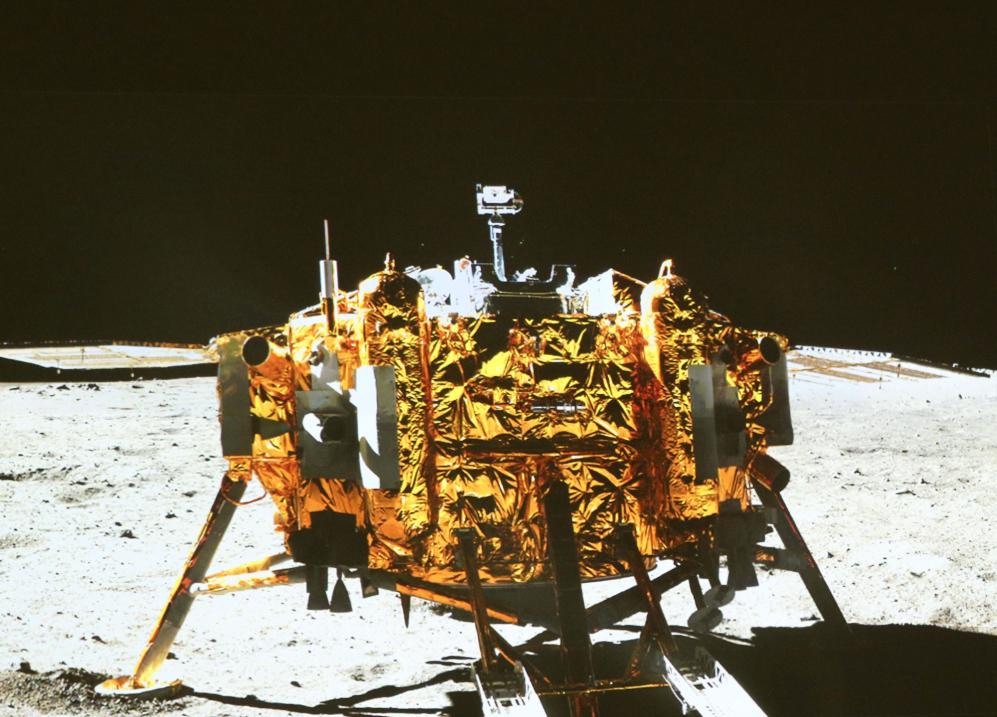 This image taken by the on-board camera of the "Yutu" or "Jade Rabbit" rover, and made off the screen of the Beijing Aerospace Control Center in Beijing on Sunday, Dec. 15, 2013, shows a photo of the Chang'e-3 lander during the mutual-photograph process. The rover and the lander took photos of each other Sunday night, marking the success of the Chang'e-3 lunar probe mission. (AP Photo/Xinhua, Ding Lin) NO SALES