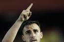 Valencia's Paco Alcacer celebrates after scoring against Basel during the Europa League quarterfinal, second leg soccer match at the Mestalla stadium in Valencia, Spain, on Thursday, April 10, 2014. Valencia lost 3-0 in the first leg at Basel. (AP Photo/Alberto Saiz)