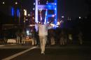 A man approaches Turkish military with his hands up at the entrance to the Bosphorus bridge in Istanbul on July 16, 2016