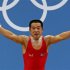 North Korea's Yun Chol Om reacts after setting a new Olympic record on the clean & jerk 56Kg Group B weightlifting competition at the London 2012 Olympic Games