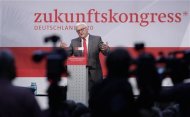 Leader of Germany's Social Democratic Party (SPD) parliamentary faction Frank-Walter Steinmeier delivers a speech during a SPD parliamentary group congress in Berlin, September 15, 2012. The slogan in the background reads: &quot;Future Congress&quot;. REUTERS/Tobias Schwarz