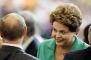Brazil's President Dilma Rousseff speaks with Russian President Vladimir Putin during the World Cup final soccer match between Germany and Argentina at the Maracana Stadium in Rio de Janeiro, Brazil, Sunday, July 13, 2014. (AP Photo/Themba Hadebe)