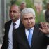 Cyprus' President Dimitris Christofias waves to the media as he arrives at the center for the Informal European Integrated Maritime policy in Limassol, Cyprus, Monday, Oct. 8, 2012. (AP Photo/Petros Karadjias)
