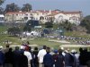 Merrick of the U.S. tees off on the ninth hole with the clubhouse above the ninth green during the final round of the Northern Trust Open golf tournament in Los Angeles