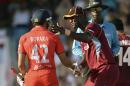 West Indies' Sammy shakes hands with England's Bopara during the first T20 international cricket match at Kensington Oval in Bridgetown