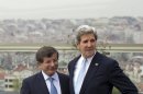 Turkish Foreign Minister Ahmet Davutoglu, left, shows U.S. Secretary of State John Kerry, the skyline of Istanbul before the start of a meeting on Sunday, April 21, 2013, in Istanbul, Turkey. Kerry is wrapping up a 24-hour visit to Istanbul with talks aimed at improving ties between Turkey and Israel and pushing ahead with Mideast peace efforts. (AP Photo/Evan Vucci, Pool)