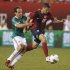U.S. midfielder Robbie Rogers is pulled down by Mexico defender Gerardo Torrado during the second half of their friendly soccer match in Philadelphia