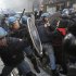 Students clash with police during a demonstration in Milan, Italy, Thursday, Nov. 17, 2011. University students are protesting in Milan and Rome against budget cuts and a lack of jobs, hours before new Italian Premier Mario Monti reveals his anti-crisis strategy in Parliament. Across Italy, transport unions called all-day walkouts or strikes of several hours Thursday to demand better work contracts. Scuffles among students were reported at the start of the demonstration in Milan, where they hoped to march to Bocconi University, which trains Italy's business elite. Monti, an economist, is Bocconi's president and is scheduled to speak in the afternoon ahead of a confidence vote on the government he formed on Wednesday. (AP Photo/Luca Bruno)