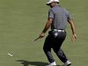 Tiger Woods reacts as he misses a birdie on the second green during the first round the Masters golf tournament Thursday, April 5, 2012, in Augusta, Ga. (AP Photo/David J. Phillip)