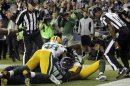 Referees wait to make the call on whether Tate caught the game winning touchdown against the Packers in Seattle