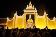 People take photos of the crematorium containing late king Norodom Sihanouk in Phnom Penh on February 3, 2013. Cambodia is due to hold an elaborate cremation ceremony on Monday for its revered king, part of a week-long funeral for the colourful late royal