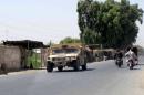Afghan National Police armored vehicle patrols on a street in Lashkar Gah capital of Helmand
