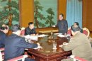 North Korean leader Kim Jong-Un presides over a consultative meeting with officials about state security and foreign affairs in this undated recent picture
