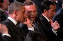 U.S. President Barack Obama and Prime Minister of Australia Tony Abbott chat prior to the start of the Welcome to Country ceremony by Aboriginal and Torres Strait Island people at the G-20 summit in Brisbane, Australia, Saturday, Nov. 15, 2014. (AP Photo/Mark Baker,Pool)