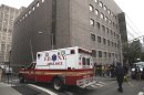 FILE - In this Wednesday, Oct. 31, 2012 file photo, an ambulance departs Bellevue Hospital in New York where patients were being evacuated. One of two New York hospitals that had to evacuate patients at the height of Superstorm Sandy is set to begin reopening. In a statement on its website, officials at NYU Langone Medical Center say "almost all" practices are scheduled to restart Monday Nov. 5, 2012 though some doctors will see patients at alternate locations. At Bellevue Hospital Center an official there said the hospital could be out of commission for at least two more weeks. (AP Photo/Mark Lennihan)