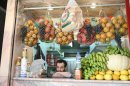 A Syrian juice vendor waits for customers in Damascus in April 2012