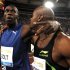 FILE - The May 26, 2011 file photo shows Jamaica's Asafa Powell, right, celebrating with his fellow-countryman Usain Bolt following the men's 100 meters event at the Golden Gala athletics meeting, in Rome. On Thursday, Aug 25, 2011 Asafa Powell has been ruled out of the 100 meters at the world championships because of a groin injury, eliminating defending champion Usain Bolt's biggest rival from the marquee event. (AP Photo/Andrew Medichini)