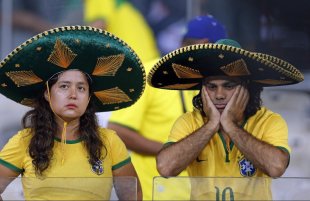 Brazil fans grieve after the World Cup semifinal match. (AP)
