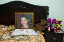 CORRECTS LAST NAME SPELLING AND ADDS FIRST NAME 'EBED' - In this Oct 17, 2012 photo, an image of late Ebed Jaasiel Yanes, 15, sits on his bed at his parent's home in Tegucigalpa, Honduras. According to his relatives, Yanes was killed by soldiers early Sunday, May 27, when he was riding a motorcycle near a military checkpoint. (AP Photo/Esteban Felix)