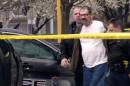 In this Sunday, April 13, 2014 image from video provided by KCTV-5, Frazier Glenn Cross, also known as Frazier Glenn Miller, is escorted by police in an elementary school parking lot in Overland Park, Kan. Cross, 73, accused of killing three people in attacks at a Jewish community center and Jewish retirement complex near Kansas City, is a known white supremacist and former Ku Klux Klan leader who was once the subject of a nationwide manhunt. (AP Photo/KCTV-5) MANDATORY CREDIT
