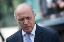 French Foreign Minister Laurent Fabius speaks to journalists outside the Palais Coburg Hotel, where the Iran nuclear talks meetings were being held in Vienna on July 12, 2015