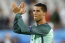 Portugal's Cristiano Ronaldo applauds fans at the end of the Euro 2016 round of 16 soccer match between Croatia and Portugal at the Bollaert stadium in Lens, France, Saturday, June 25, 2016. Portugal won 1-0. (AP Photo/Frank Augstein)