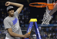 Kentucky forward Anthony Davis celebrates as he cuts the net after the NCAA Final Four tournament college basketball championship game Monday, April 2, 2012, in New Orleans. Kentucky beat Kansas 67-59. (AP Photo/David J. Phillip)