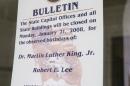 In this Jan. 16, 2008, file photo, a note is posted on a door at the Arkansas state Capitol in Little Rock, Ark., indicating state offices will close in observance of civil rights leader Martin Luther King Jr. and Confederate General Robert E. Lee's birthdays. Lee's birthday would no longer be celebrated on the same day as King under a bill introduced Wednesday, Jan. 21, 2015, by Arkansas Republican Rep. Nate Bell. Arkansas is one of three states, along with Alabama and Mississippi, that jointly celebrate King and Lee. (AP Photo/Danny Johnston, File)