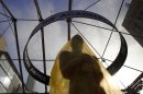 An Oscar statue under a sheet of protective plastic stands on the red carpet outside the Kodak Theatre as preparations continue for the 84th Academy Awards in Los Angeles on Saturday, Feb. 25, 2012. The Oscars will be held on Sunday. (AP Photo/Amy Sancetta)