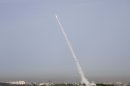 A rocket is launched from the Israeli anti-missile system known as Iron Dome in order to intercept a rocket fired by Palestinian militants from the Gaza Strip in Ashdod, Israel, Sunday, March 11, 2012. Palestinian witnesses say a militant and a 12-year-old boy have been killed in Israeli airstrikes in the Gaza Strip. The Israeli military confirmed one airstrike early Sunday and had no immediate comment on the report of a second. Israeli police say three rockets fired from Gaza landed in southern Israel overnight and Sunday. No injuries were reported. The deadliest clashes between the two sides in over a year have entered their third day showing no signs of subsiding. (AP Photo/Ariel Schalit)