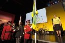 Jamaica's flag is raised to celebrate the country's 50th anniversary of its independence from Britain during the London 2012 Olympic Games at the Jamaica House in London