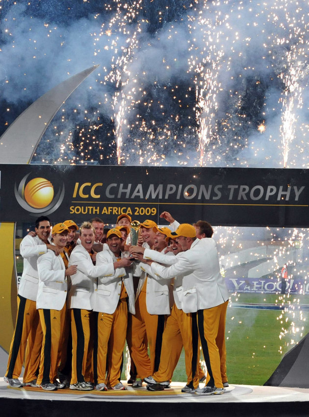 The Australian team celebrate with the ICC Champions Trophy after defeating New Zealand in the final played