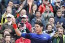 Canada's Milos Raonic greets spectators after winning his first round match of the French Open tennis tournament against Serbia's Janko Tipsarevic at Roland Garros stadium in Paris, France, Monday, May 23, 2016. (AP Photo/Alastair Grant)