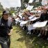 Phil Mickelson signs autographs after a practice round for the U.S. Open Championship golf tournament Tuesday, June 12, 2012, at The Olympic Club in San Francisco. (AP Photo/Eric Gay)