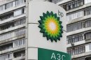 A BP logo is seen in front of an apartment block near a petrol station in Moscow October 22, 2012.