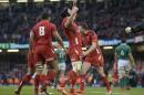 Wales' Sam Warburton, centre, celebrates at the final whistle after defeating Ireland during their Six Nations rugby union match at the Millennium Stadium, Cardiff, Wales, Saturday March 14, 2015. (AP Photo/Joe Giddens/PA) UNITED KINGDOM OUT