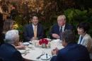 US President Donald Trump, Japanese Prime Minister Shinzo Abe (2nd-L), his wife Akie Abe (R), US first lady Melania Trump (L) and New England Patriots owner Robert Kraft (2nd-L), sit down for dinner at Trump's Mar-a-Lago resort on February 10, 2017
