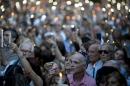 People hold candles during the one-year anniversary of prosecutor Alberto Nisman's death in Buenos Aires, Argentina, Monday, Jan. 18, 2016. Jewish rights groups have organized acts in several Argentine cities. Nisman was found dead in the bathroom of his Buenos Aires apartment on Jan. 18, 2015 with a bullet to his head hours before he was to detail to Congress his accusations that former President Cristina Fernandez and top administration officials orchestrated a secret deal with Iran to shield officials allegedly responsible for the the 1994 bombing of a Jewish community center that killed 85 people. (AP Photo/Natacha Pisarenko)