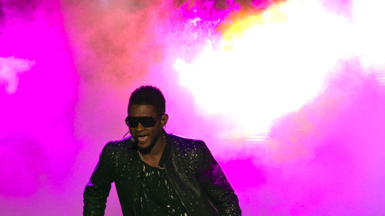 Singer Usher performs as the Xbox 360 music 