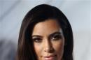 U.S. television personality Kardashian poses during a news conference in Vienna