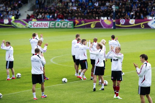 Denmark players clap during a training session in Kolobrzeg
