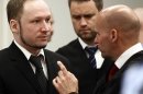 Defendant Anders Behring Breivik with his lawyers Geir Lippestad right and Odd Ivar Groen during the third day of proceedings in courtroom 250 in the courthouse in Oslo Wednesday April 18, 2012. Confessed mass killer Breivik on Wednesday called Norway's prison terms 