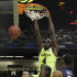 Baylor's Quincy Acy (4) dunks the ball as Xavier's Dezmine Wells, right, and Xavier's Andre Walker look on during the second half of an NCAA tournament South Regional semifinal college basketball game Friday, March 23, 2012, in Atlanta. (AP Photo/John Bazemore)