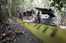 Security forces are seen at an abandoned camp in a jungle in Thailand's southern Songkhla province