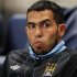 Manchester City's Carlos Tevez sits on the bench before their Champions League Group A soccer match against Napoli at the Etihad Stadium in Manchester